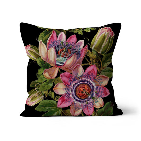 Square cushion with passion fruit flowers, buds and leaves on a black background