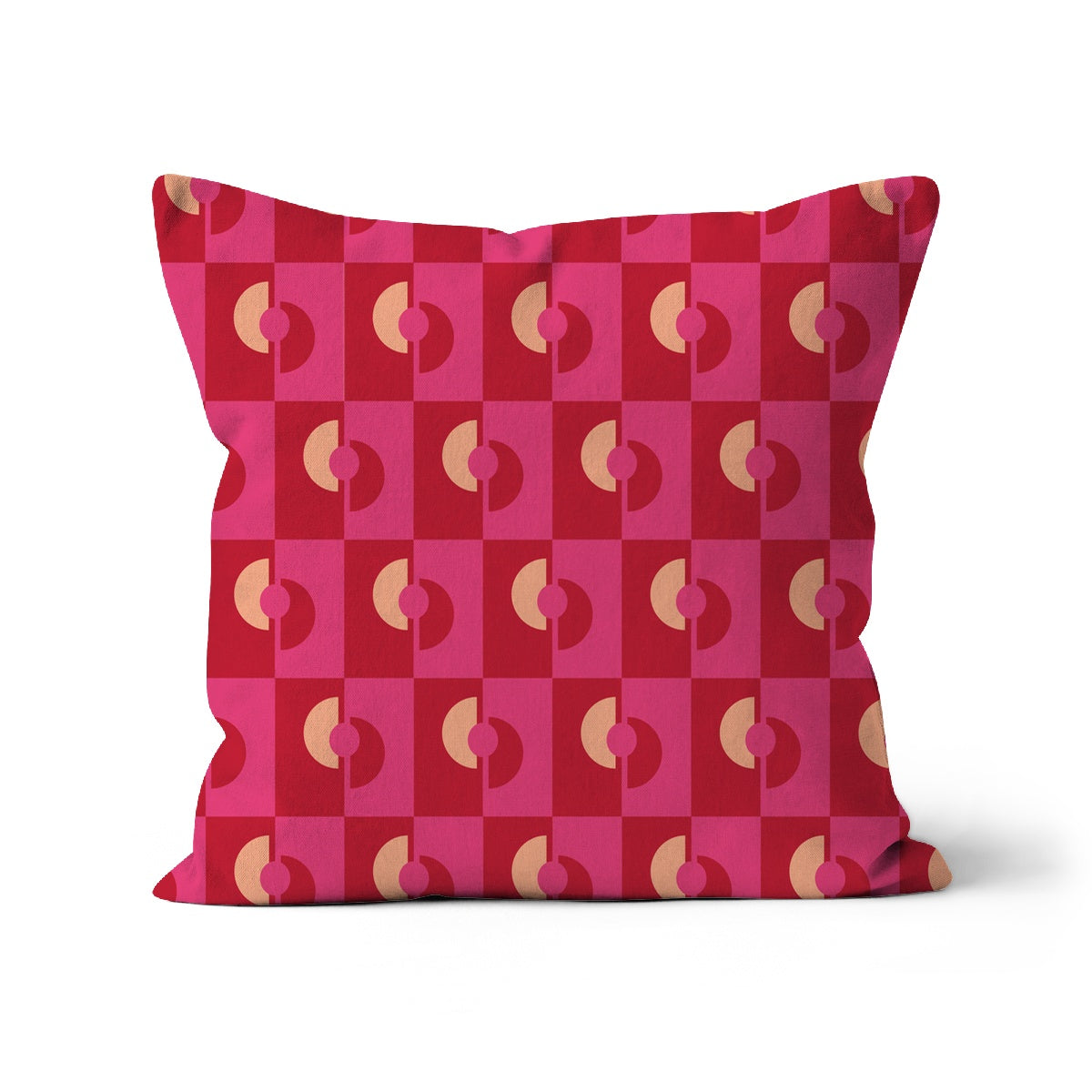 Square shaped cushion covered with a graphic repeat pattern of red and pink oblong shapes and beige half moon graphic shapes, check cotton cushion cover in pink and red.