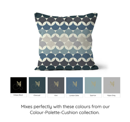 Square shaped cushion with Bauhaus style pattern, interlinking circles in shades of of blue + grey colour combination against a cream background. Mode Abode colour swatches showing blues and greys colours and shades.
