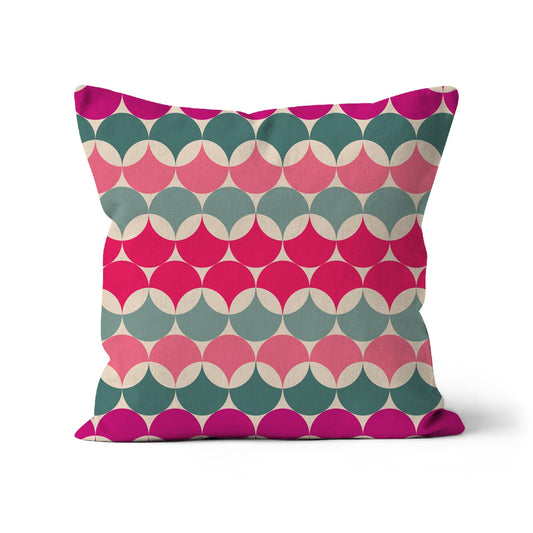 Square shaped cushion with Bauhaus style graphic pattern. Pinks and teal colour combination.