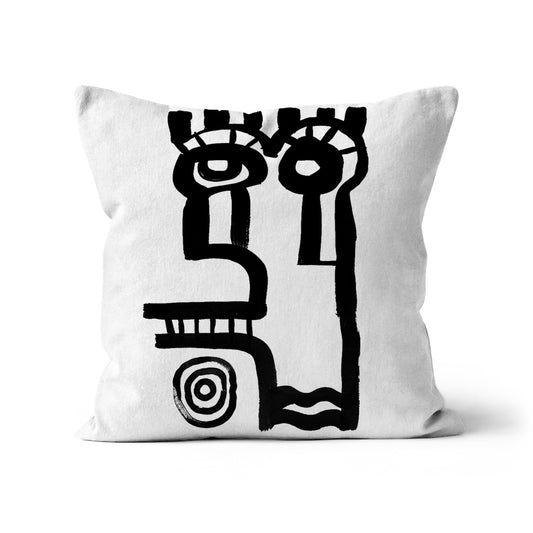  Cushion with primitive ink drawing of a contemporary abstract  face against a white background