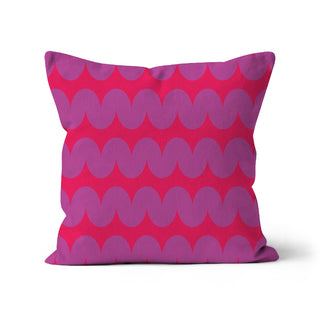 Pink pillow with purple wavy pattern on a white background
