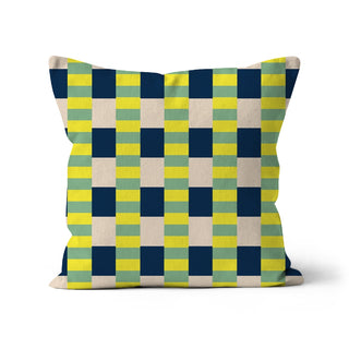 Checkered pillow with blue, green, and yellow pattern on a white background