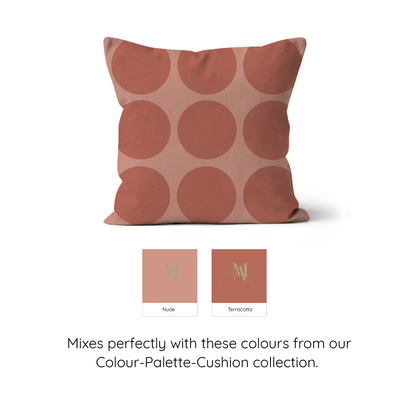 Square cushion with large spot pattern with nude and terracotta colours.