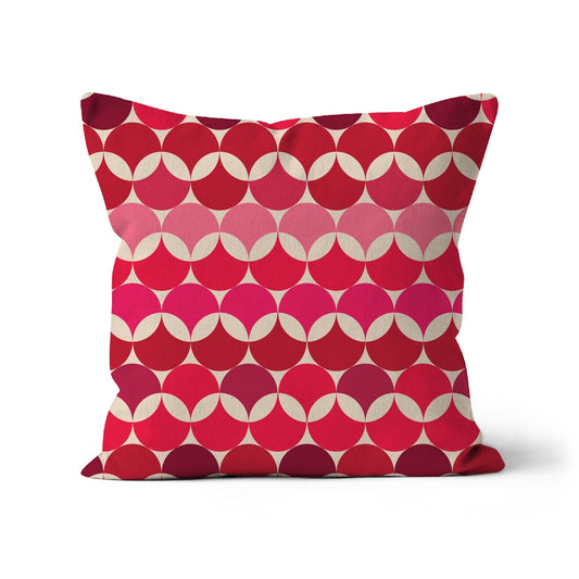 Square shaped cushion with Bauhaus style pattern, interlinking circles in Red, and Pink colour combination on a cream background.