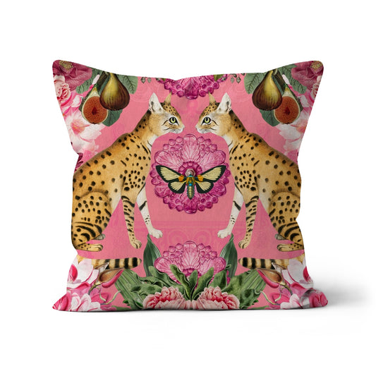 Square shaped cushion with a mirror image pattern of wild cats, tropical flowers and fruit on a pink background