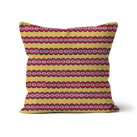 Square shape cushion with a horizontal stripes of red and yellow rows of abstract circles