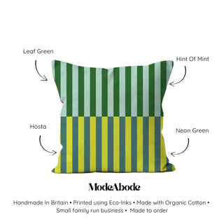 Color swatch of a striped pillow with labeled colors and ModeAbode branding.