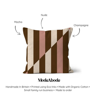 Striped pillow with color options labeled on a white background, featuring the brand 'ModeAbode'.