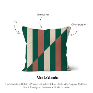 Striped pillow with 'ModeAbode' branding and color labels on a white background